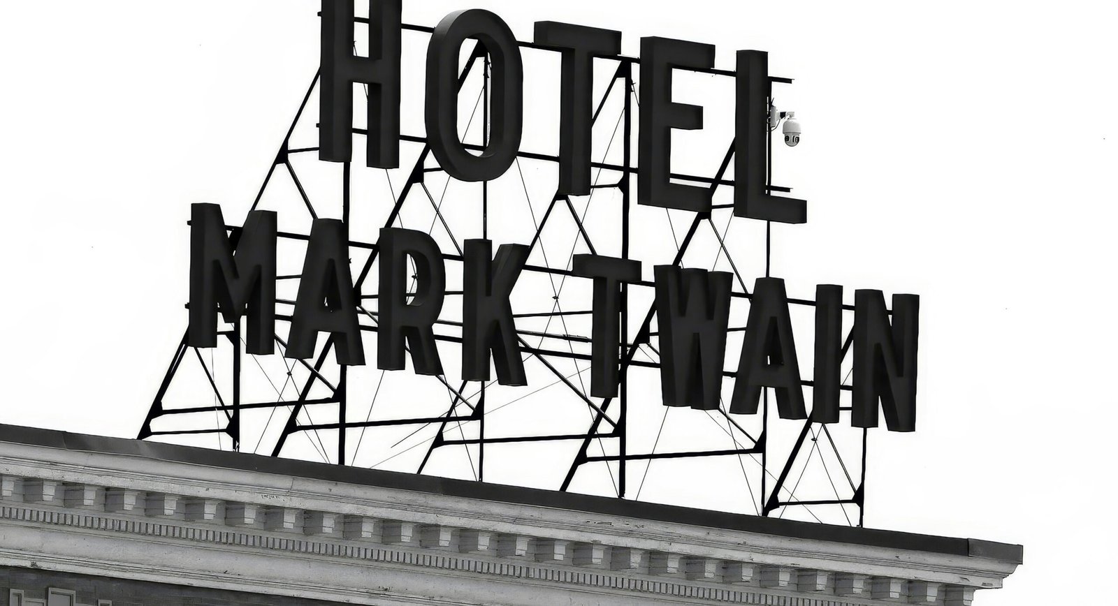 A sign that says hotel mark twain on top of a building